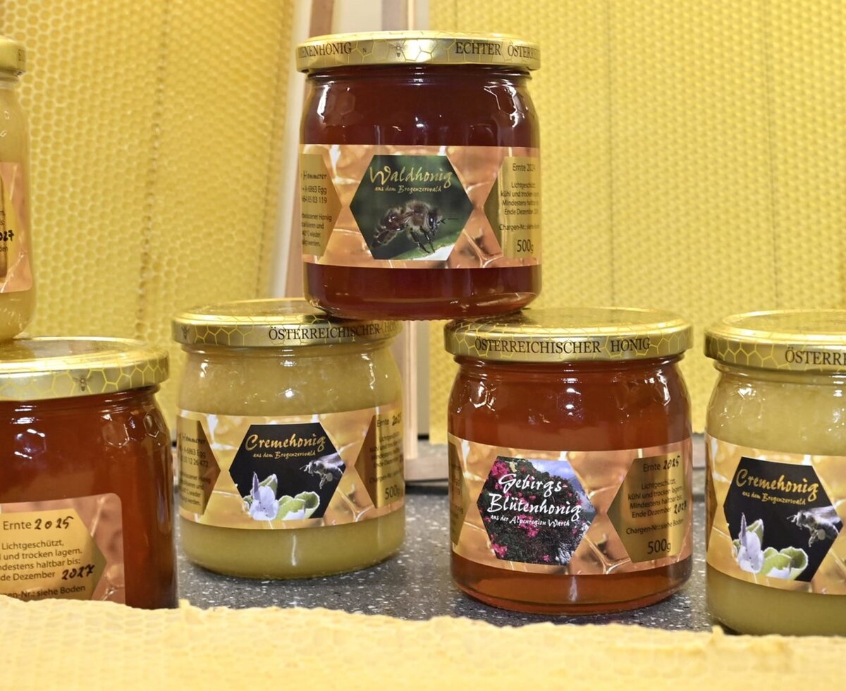 Various types of honey, such as forest honey and mountain blossom honey, available directly from the farm.