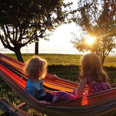 Enjoy the sunset from our hammock with a view over Lake Constance.